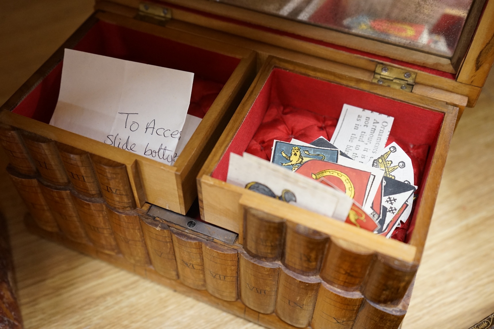 A backgammon games box, Sorrento box, a red wax seal mounted lid and a carved oak floral appliqué, 65cm wide (4)